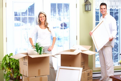Packed boxes and study items ready for a student move in Maida Vale